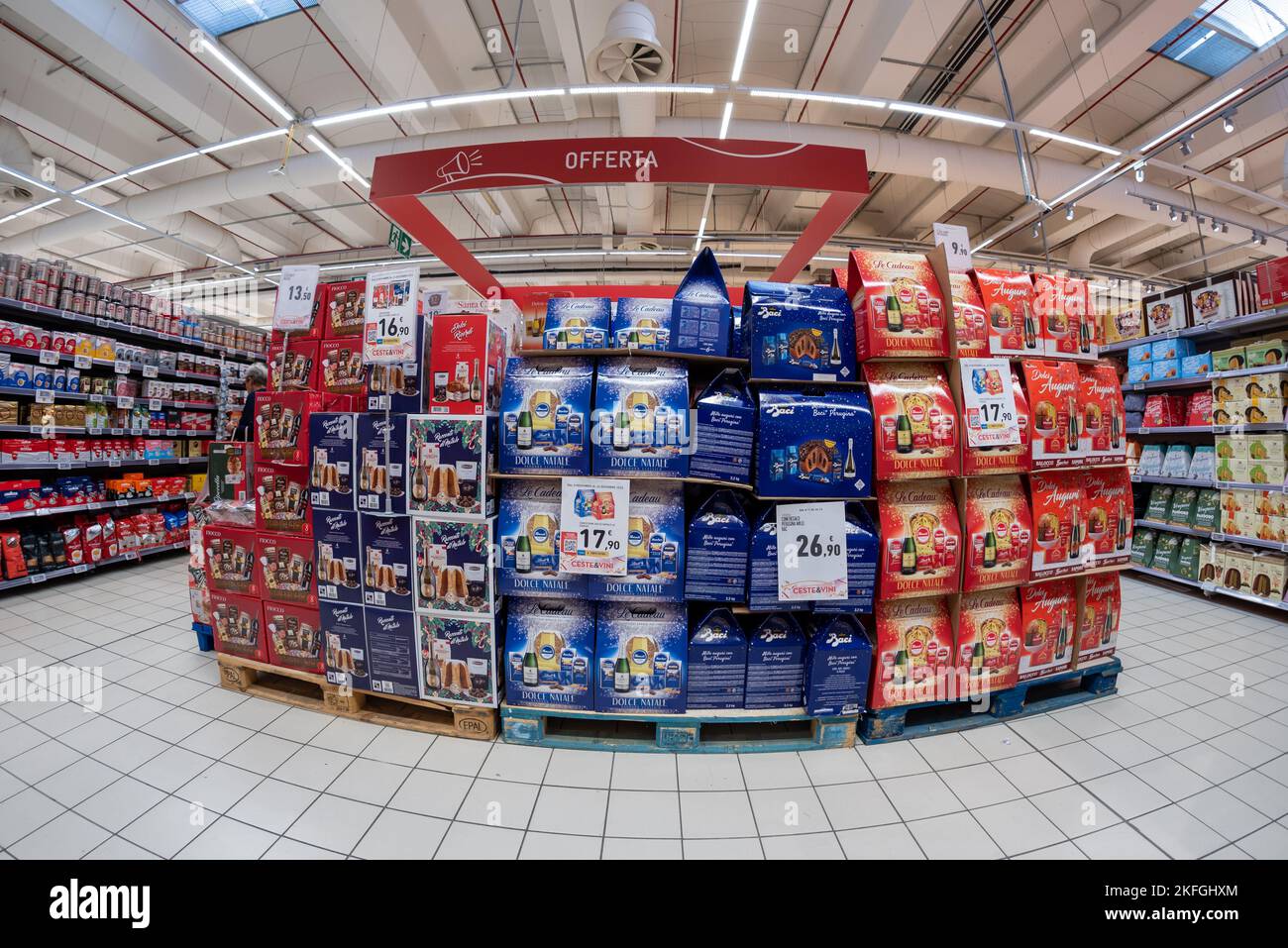 Cuneo, Italy - November 18, 2022: pallets with Christmas gift boxes with panettone, pandoro cake and bottles of sparkling wine displayed in the Conad Stock Photo