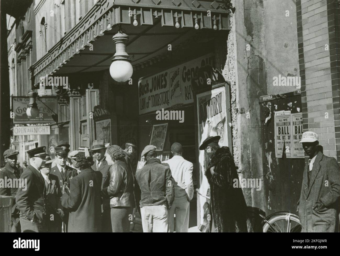 Entrance to a movie house, Beale Street, Memphis, Tennessee, October 1939. African Americans and white police officers standing under an awning at the entrance of a movie house, Beale Street, Memphis, Tennessee, October 1939. Stock Photo