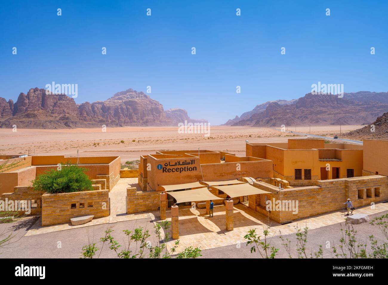 The Wadi Rum visitors centre and the edge of the 7 pillars of wisdom mountain in the distance. Stock Photo