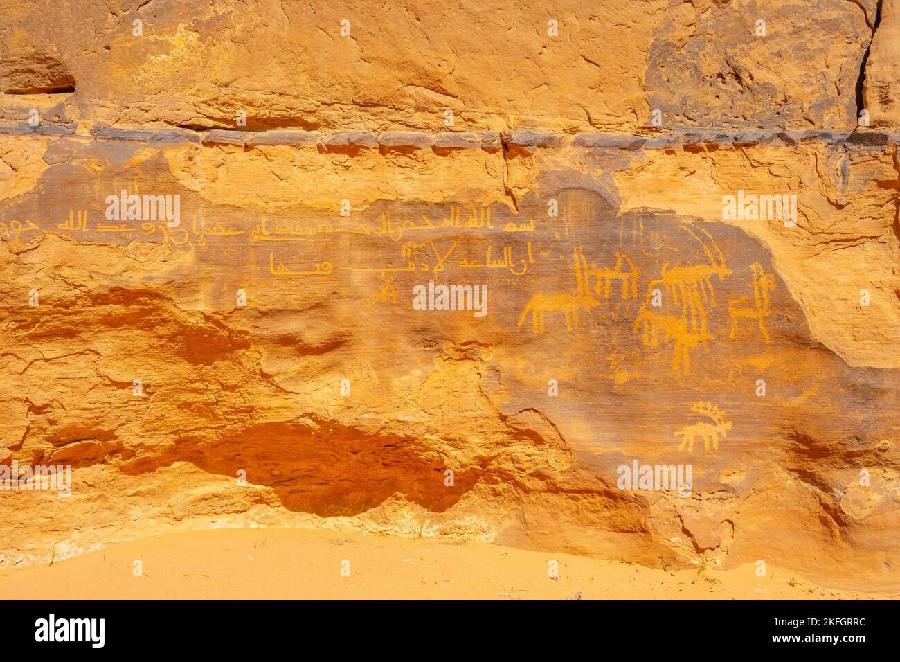 Ancient rock art on cliff face in Wadi Rum Jordan Stock Photo