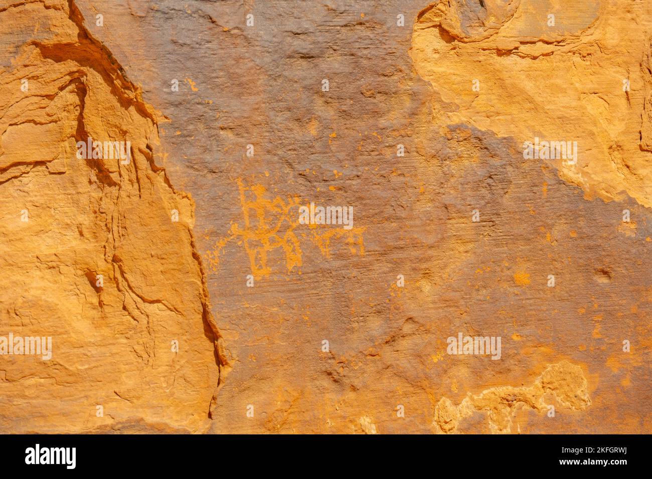 Ancient rock art on cliff face in Wadi Rum Jordan Stock Photo