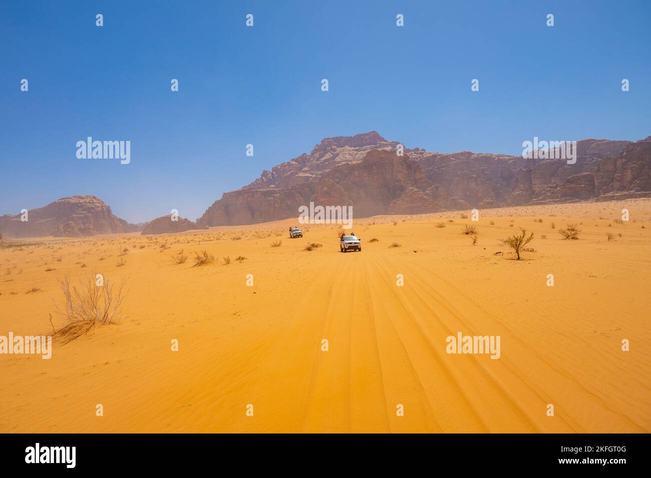 Tourists on a 4X4 safari in Wadi Rum Jordan Stock Photo