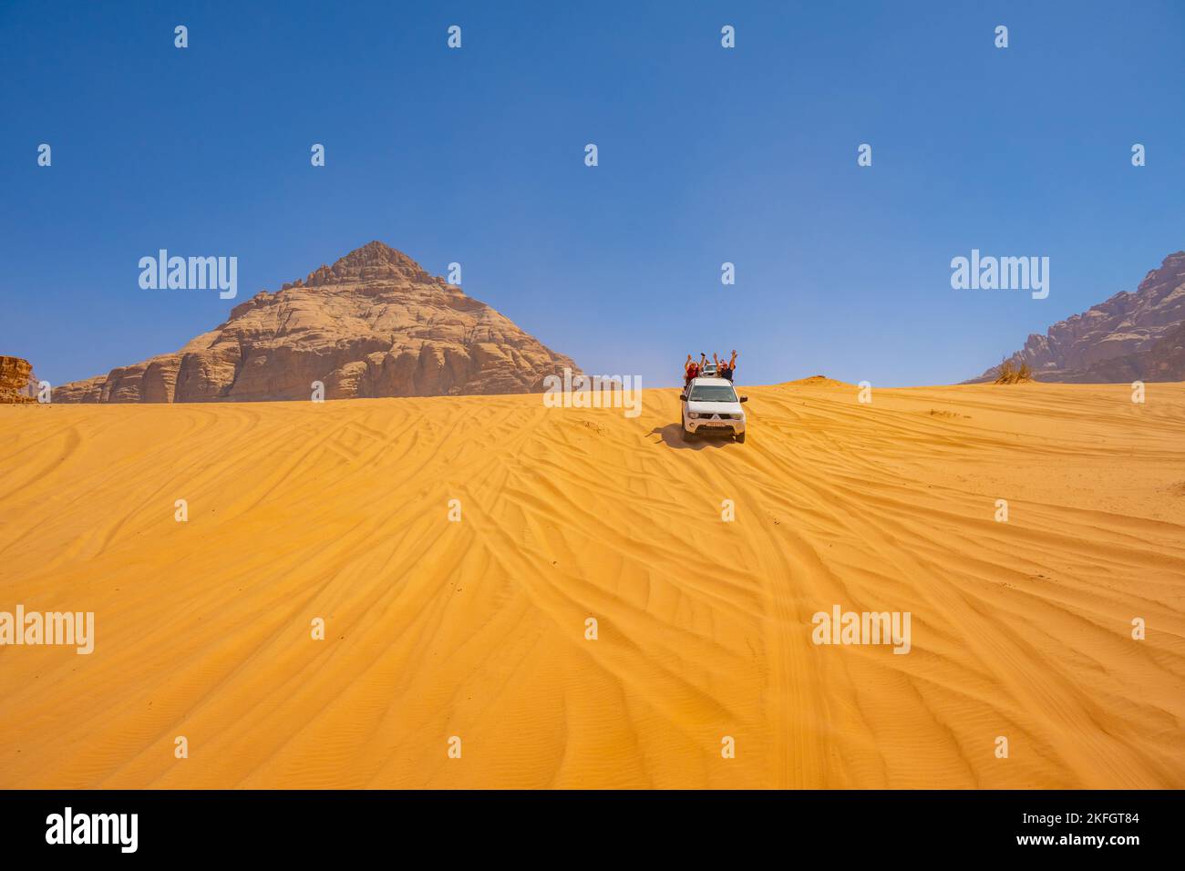 Tourists on a 4X4 safari in Wadi Rum Jordan Stock Photo