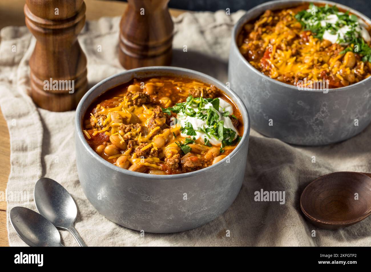 Homemade Turkey Chili Con Carne with Sour Cream and Cheese Stock Photo
