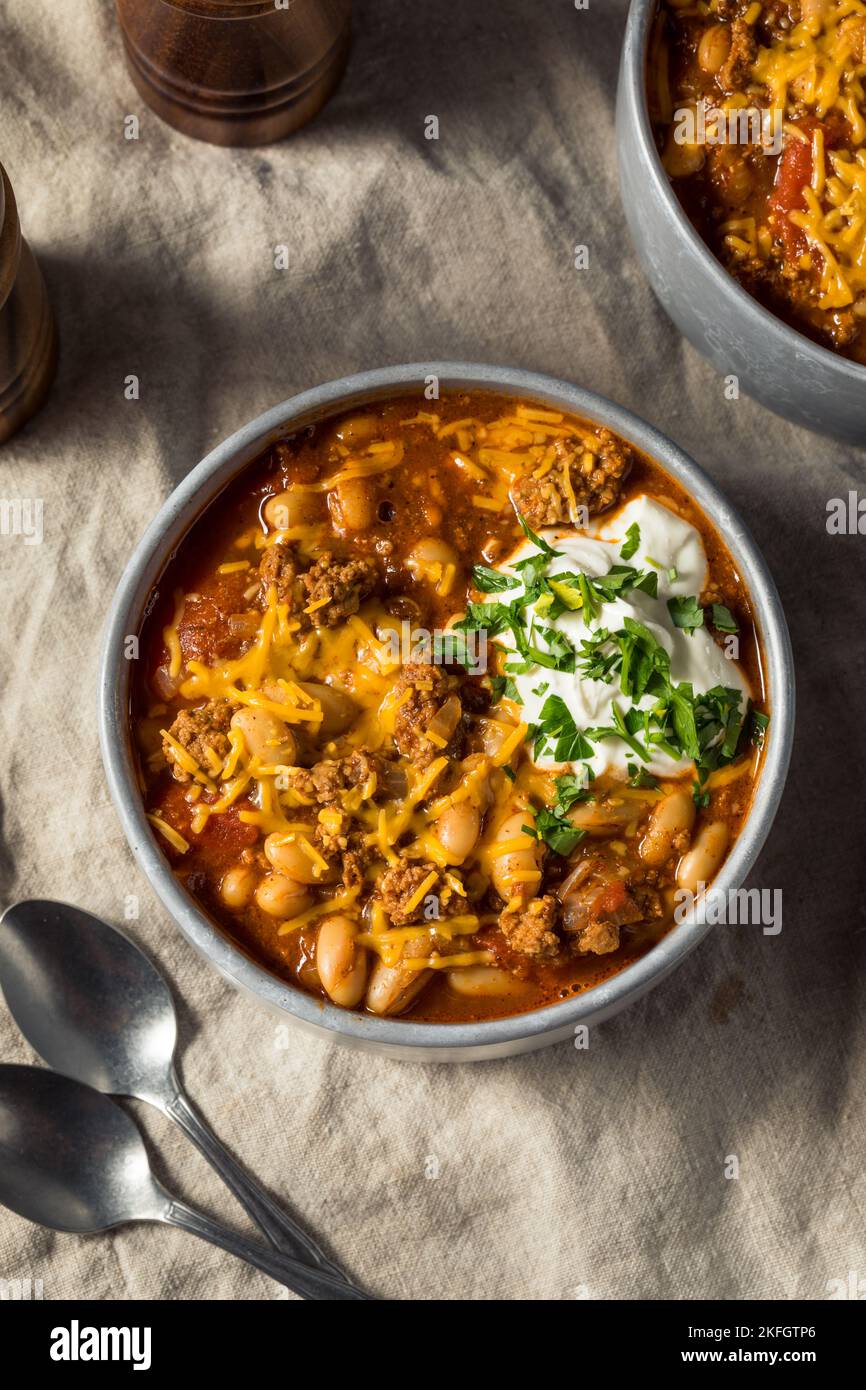 Homemade Turkey Chili Con Carne with Sour Cream and Cheese Stock Photo