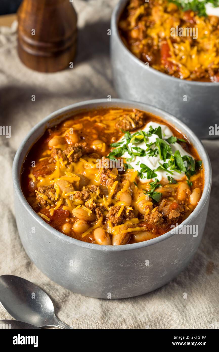 Homemade Turkey Chili Con Carne with Sour Cream and Cheese Stock Photo