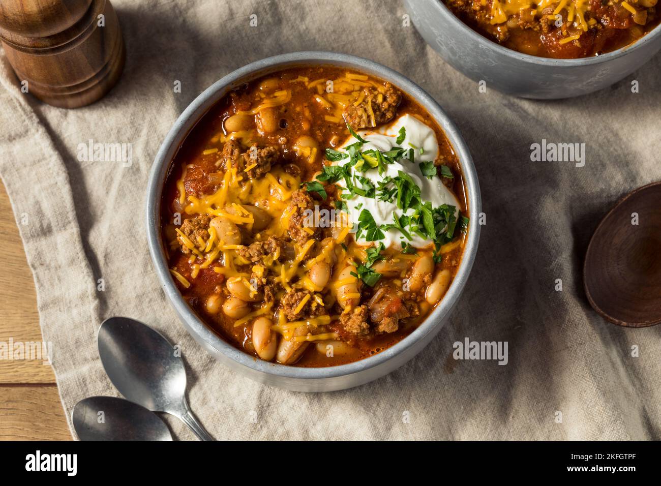 Homemade Turkey Chili Con Carne with Sour Cream and Cheese Stock Photo
