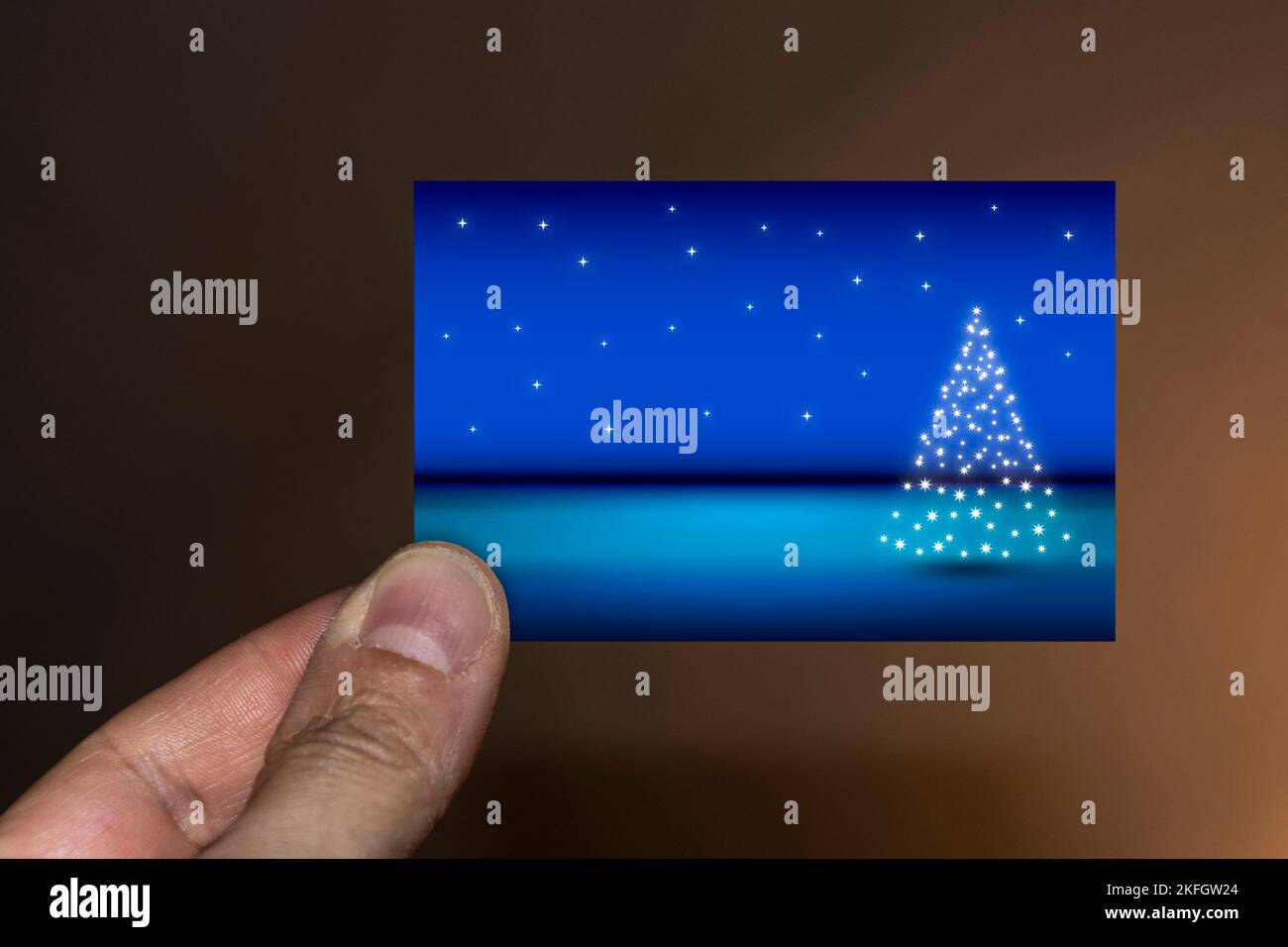 Hand holding a Christmas card Stock Photo - Alamy