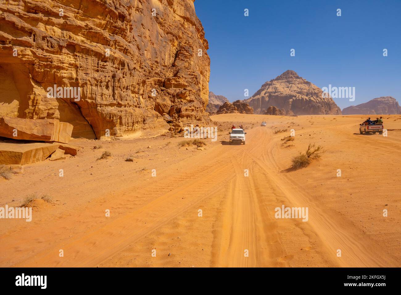 Tourists on a 4X4 safari in Wadi Rum Jordan Stock Photo