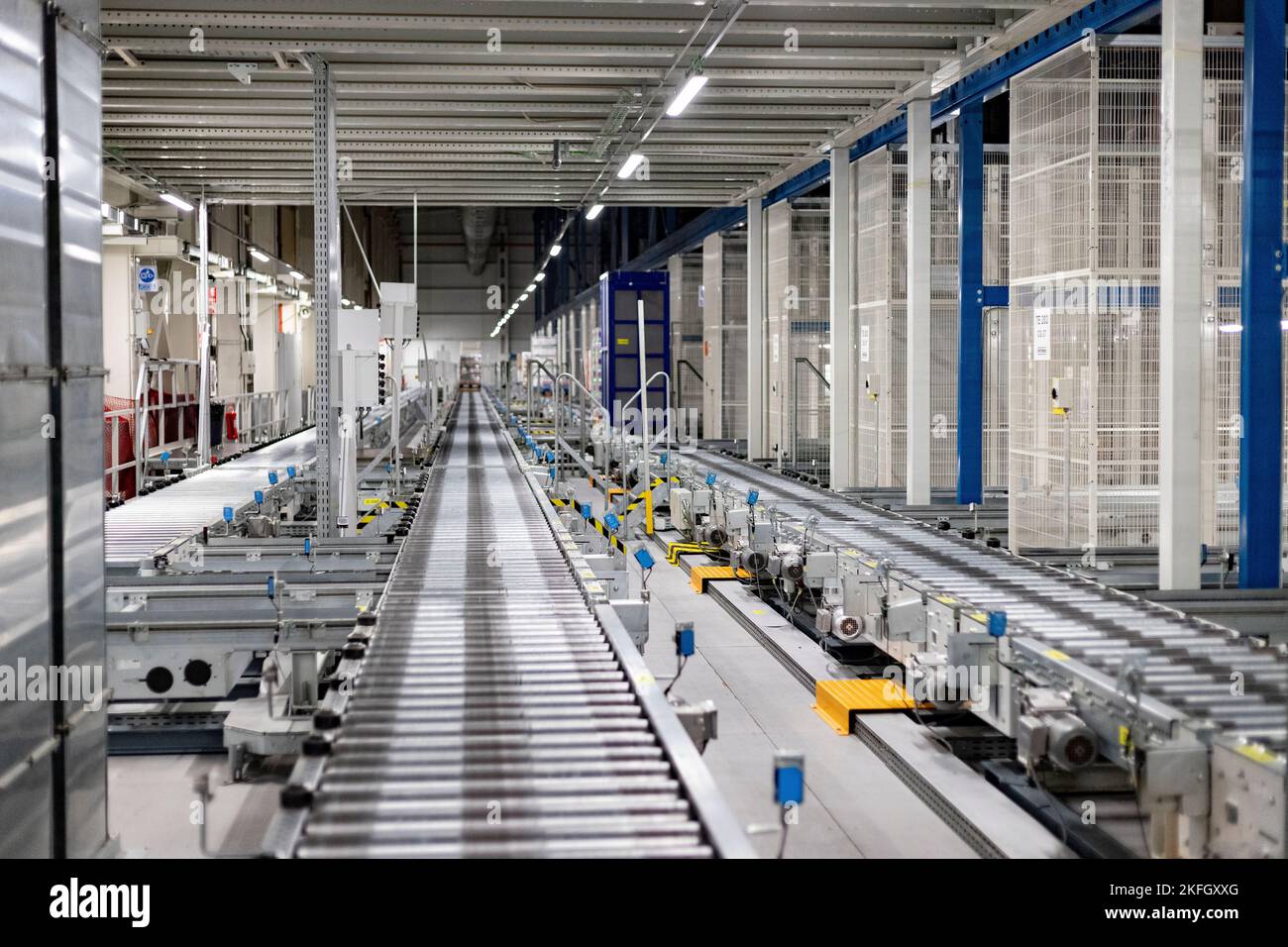 Factory. Factory in food chain. Production line. Autonomous robots moving the boxes from the shelves. Horizontal Photography. Stock Photo