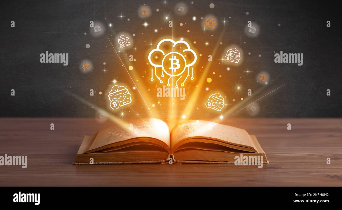 Open book with currency icons above Stock Photo - Alamy