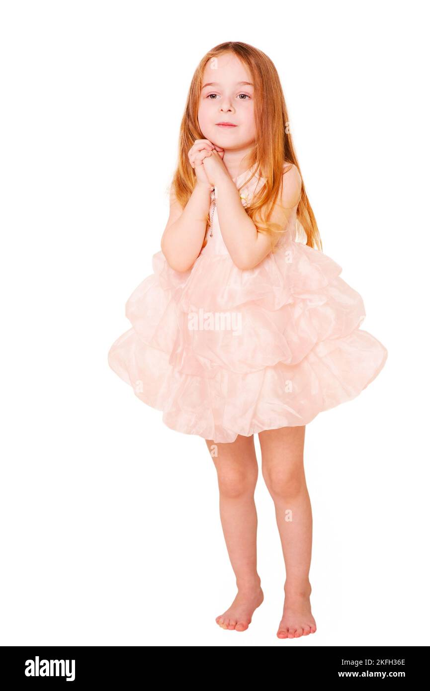 Portrait of a child in the studio. Little girl child in pink dress ...