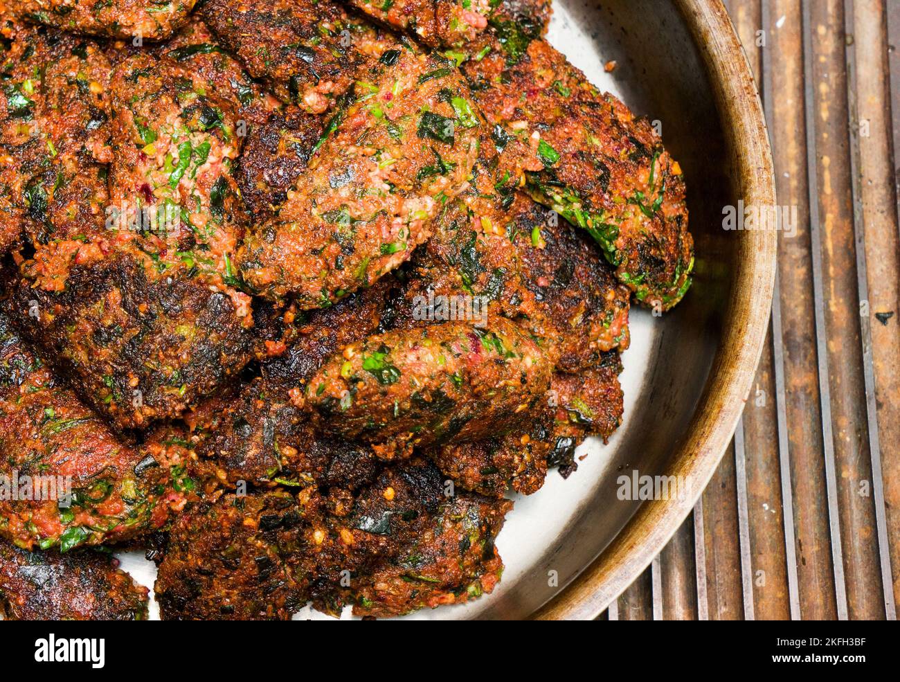 fried vegetable cutlets of walnuts in an iron pan on a gas, electric stove. Health food.Vegetarian diet Stock Photo