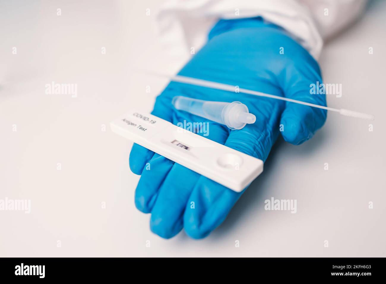 A laboratory employee taking sample PCR microtubes with cotton swab test. Diagnostic testing for