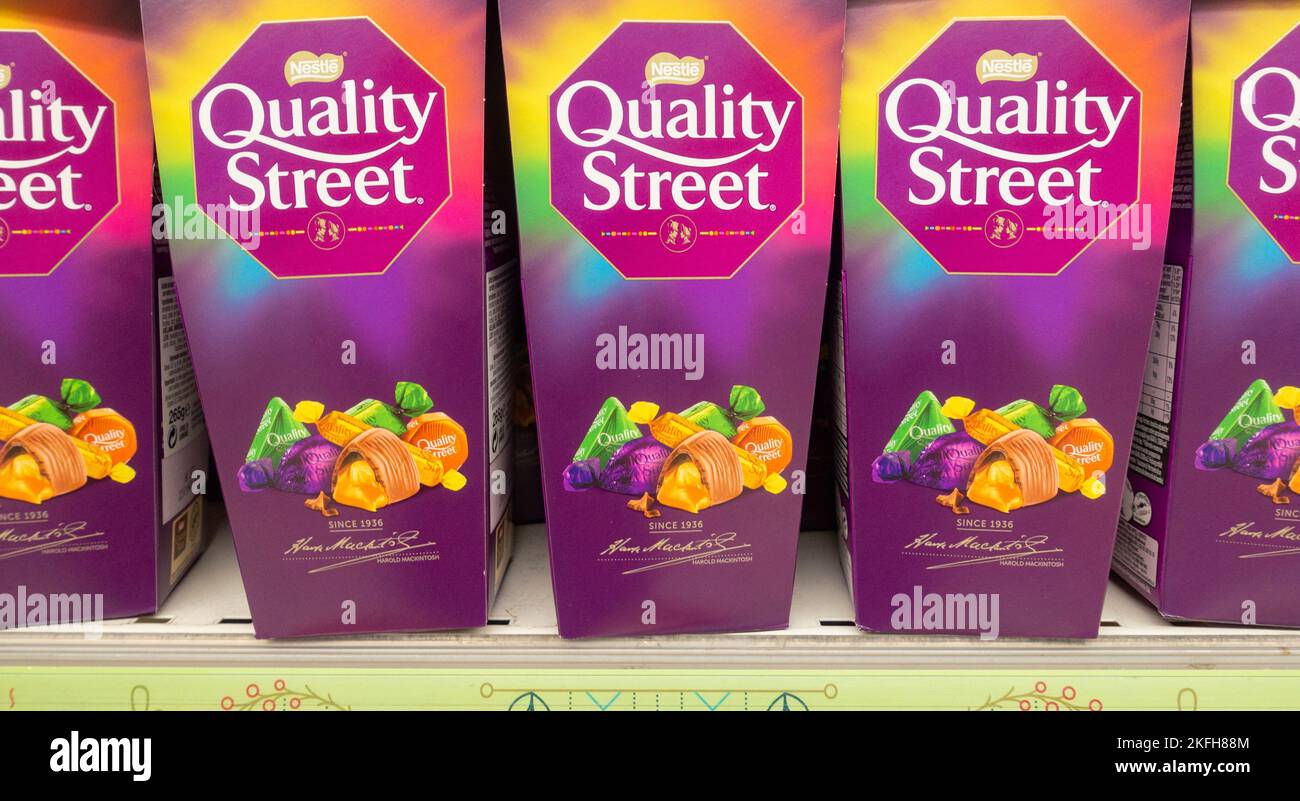 Boxes of Quality Street sweets, chocolates in supermarket Stock Photo