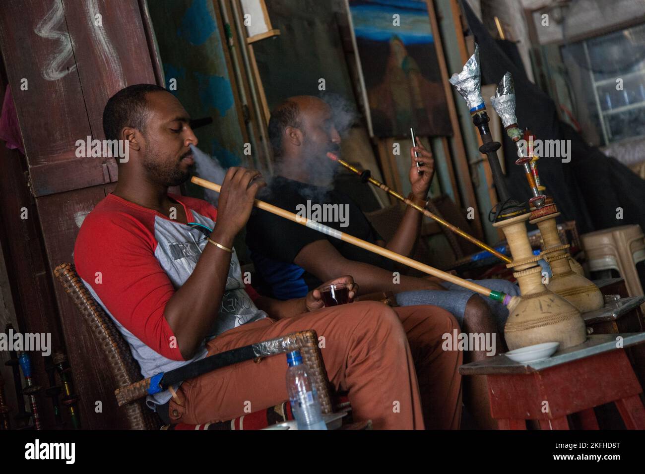 Doha, Qatar March 05, 2022 Local people smoke shisha in the old