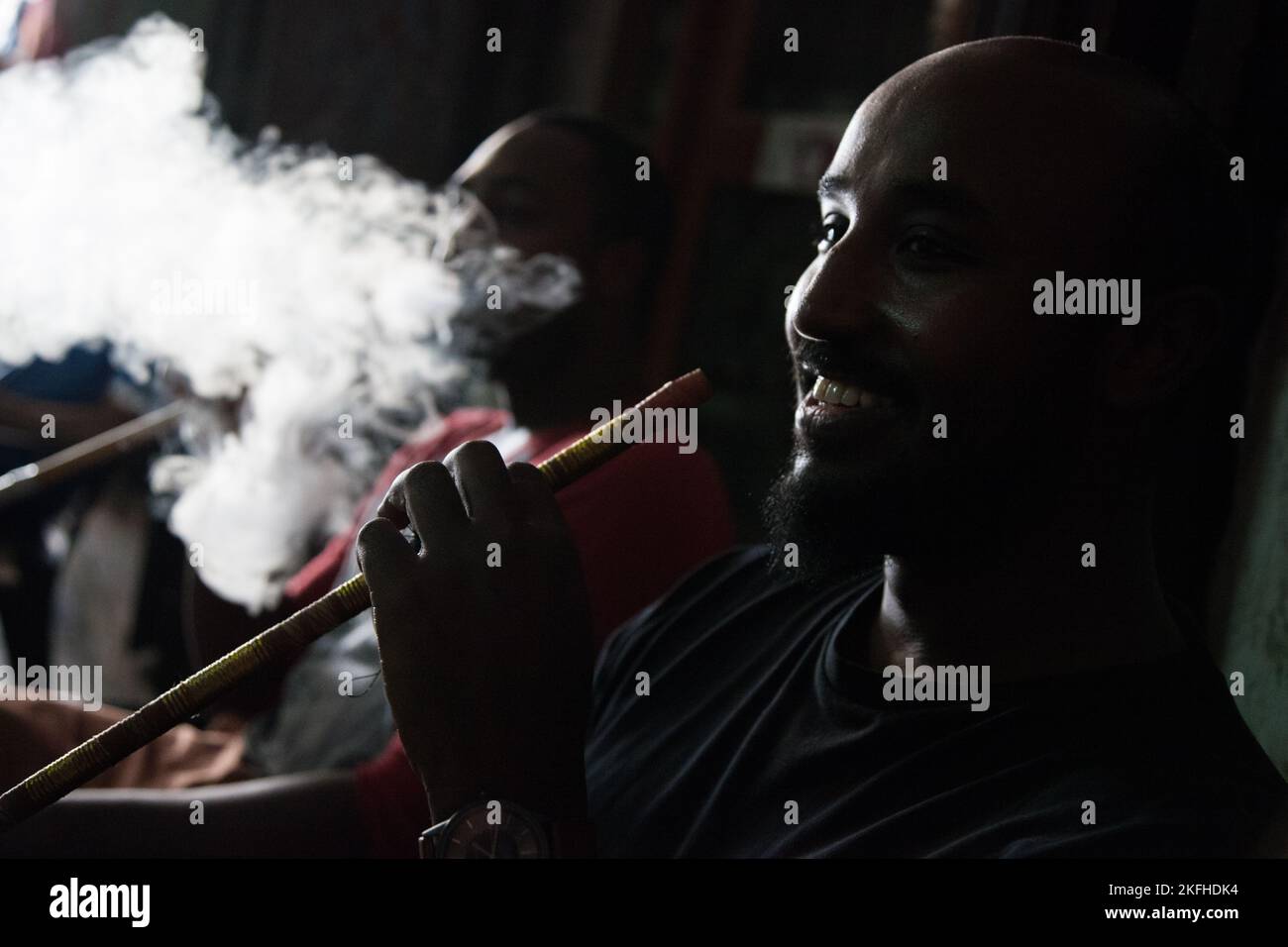 Doha, Qatar March 05, 2022 Local people smoke shisha in the old