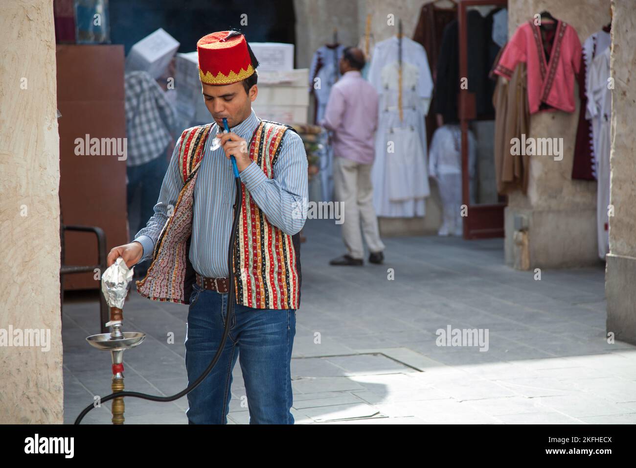 Doha, Qatar March 05, 2022 Local people smoke shisha in the old market Stock Photo Alamy