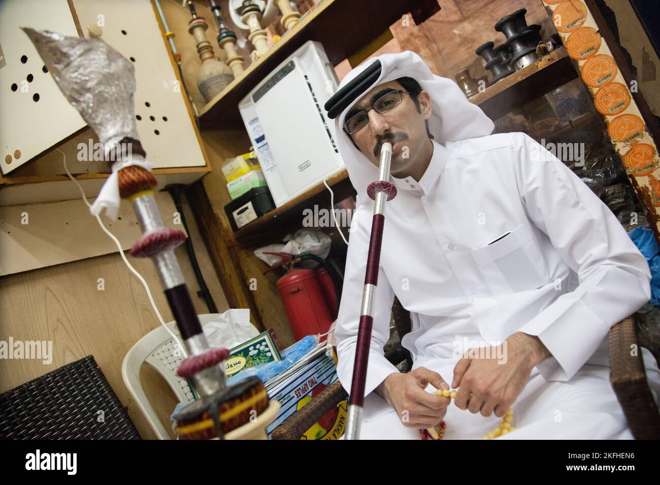 Doha, Qatar March 05, 2022 Local people smoke shisha in the old