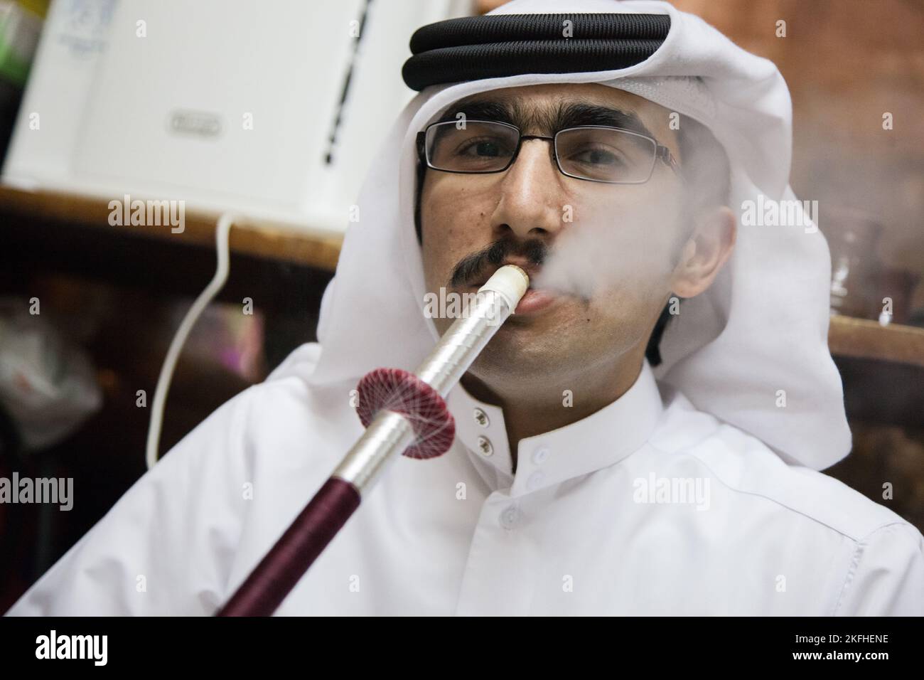 Doha, Qatar March 05, 2022 Local people smoke shisha in the old