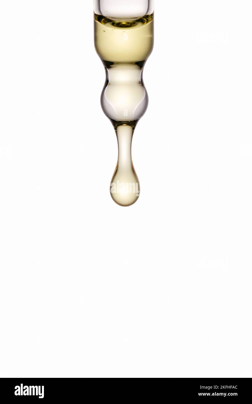 Cosmetic oil dropping out of pipette Stock Photo Alamy