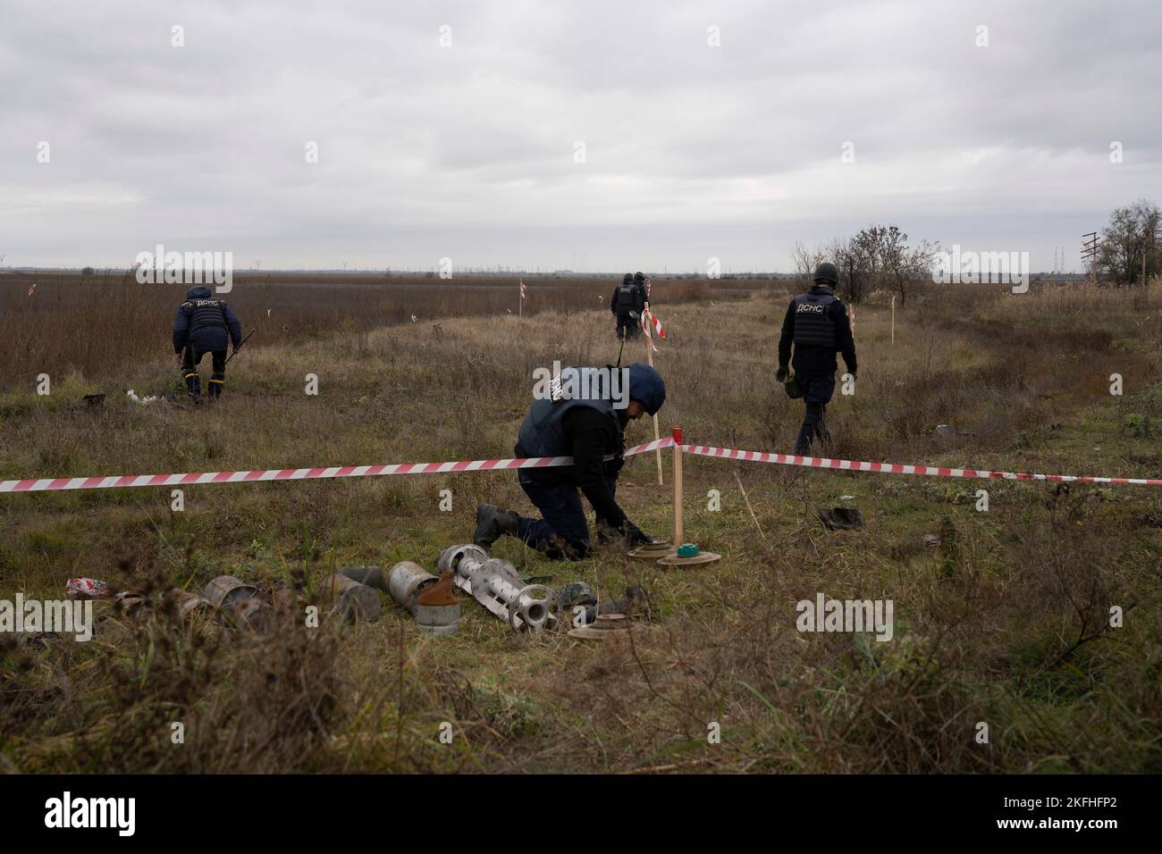 An investigator seen putting down an anti-tank mine during the process of demining. Since the liberation of Ukraine southern regional capital Kherson, the Ukrainian government has been working intensively on removing land mines in the liberated territory. Around 5000 explosives have been found and destroyed since the liberation. With the lack of sufficient robotics, the de-mining process is conducted manually and that would take at least several months to clean up the whole of Kherson city. Stock Photo
