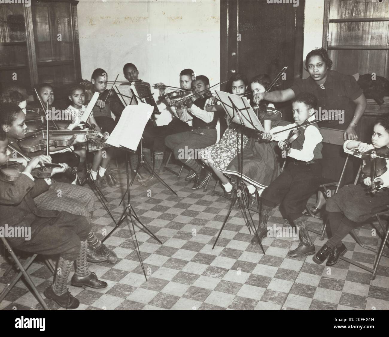 Music classes, violin, 1938 Stock Photo Alamy
