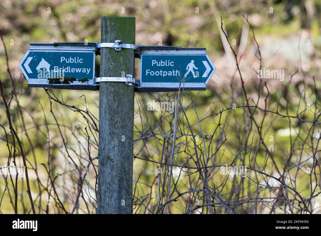 Public footpath sign and Public bridal way sign markers fastened to a