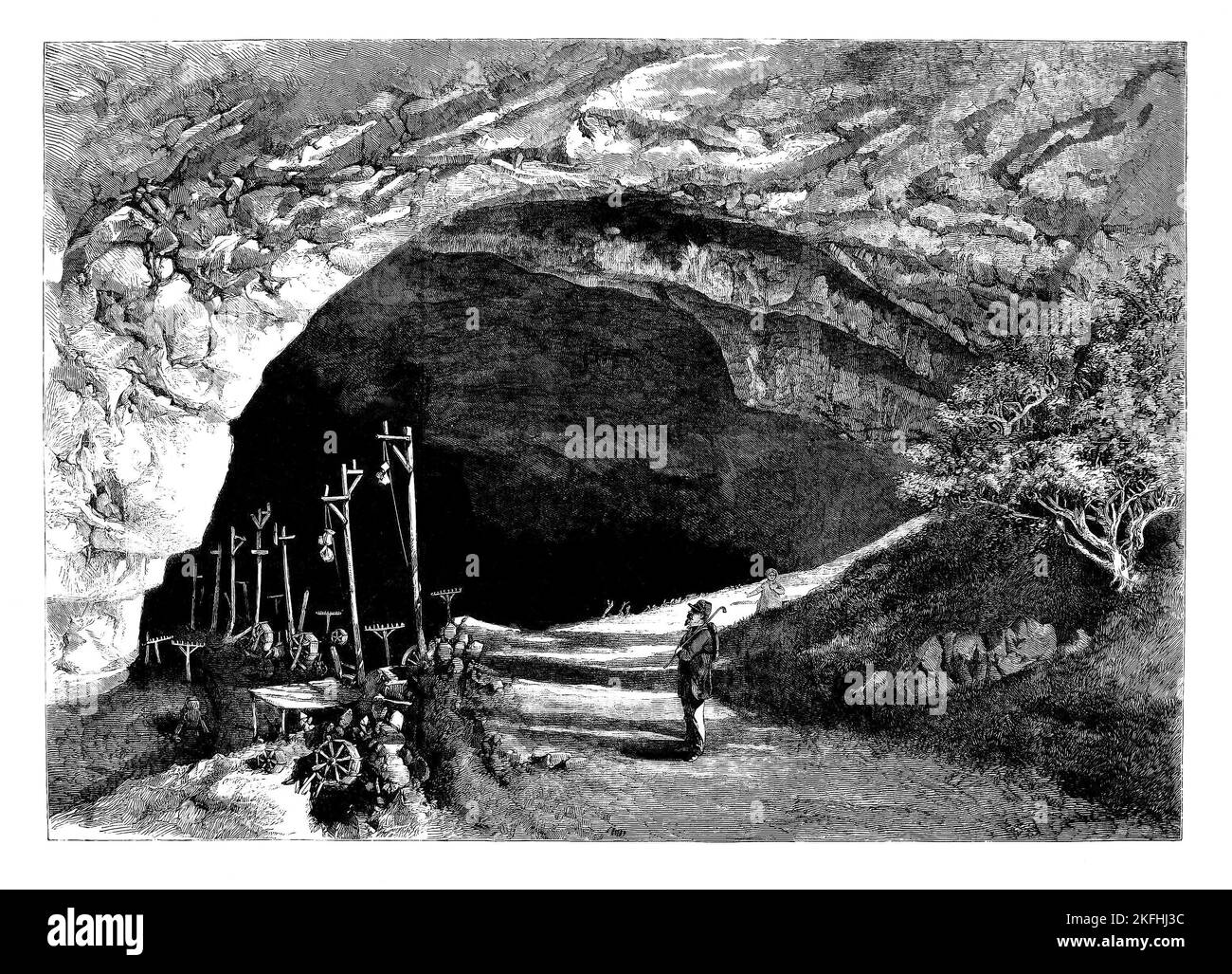 The Peak Cavern, also known as the Devil's Arse because of the flatulent-sounding noises from inside the cave when flood water is draining away, Castleton, Derbyshire, England. The cave system is the largest in the Peak District, and the main entrance is the largest cave entrance in Britain. Until 1915, the cave was home to some of Britain's last troglodytes, who lived in houses built inside the cave mouth and made a living from rope making, while the depths of the cave was apparently a haven for bandits. Stock Photo