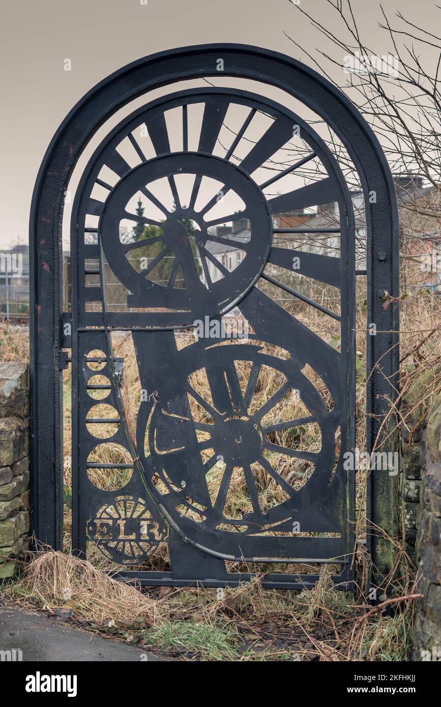 Iron gate to East Lancs Railway along the public footpath. Black iron structure. ELR Stock Photo
