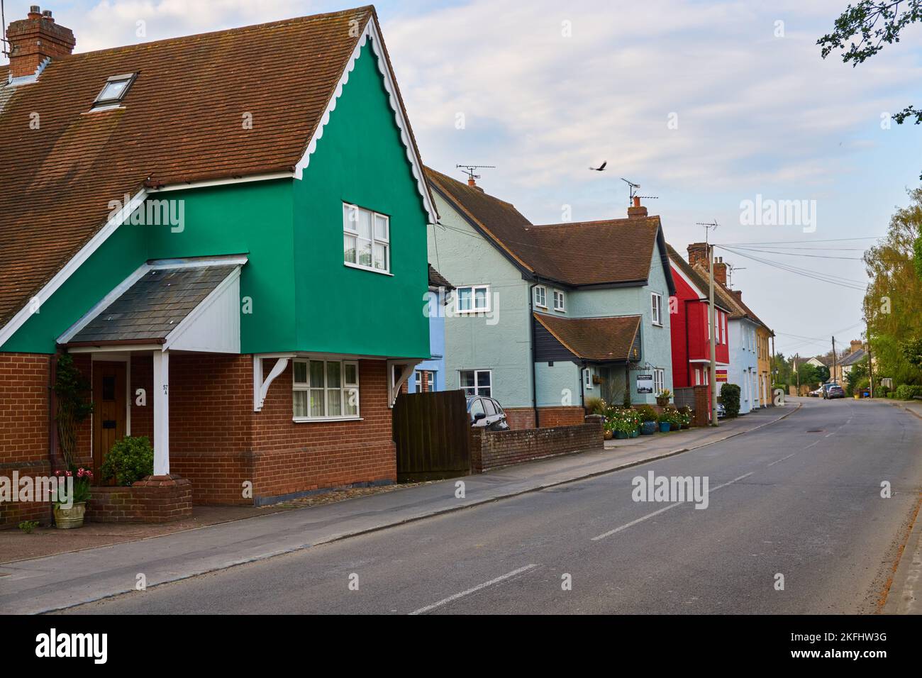 Brightly colored houses on the main road runnung through the rural town