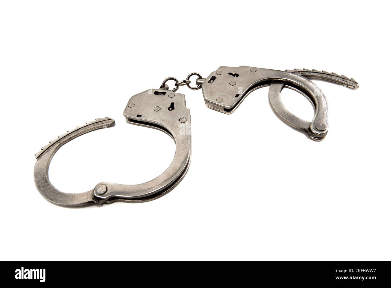 Handcuffs on a white background closeup. Handcuffs isolated. Law