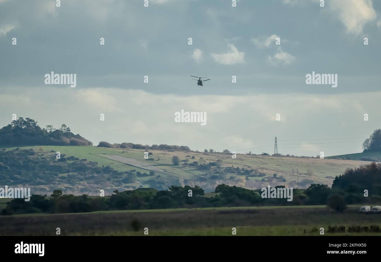 RAF Chinook tandemrotor CH47 helicopter flying fast and low in a