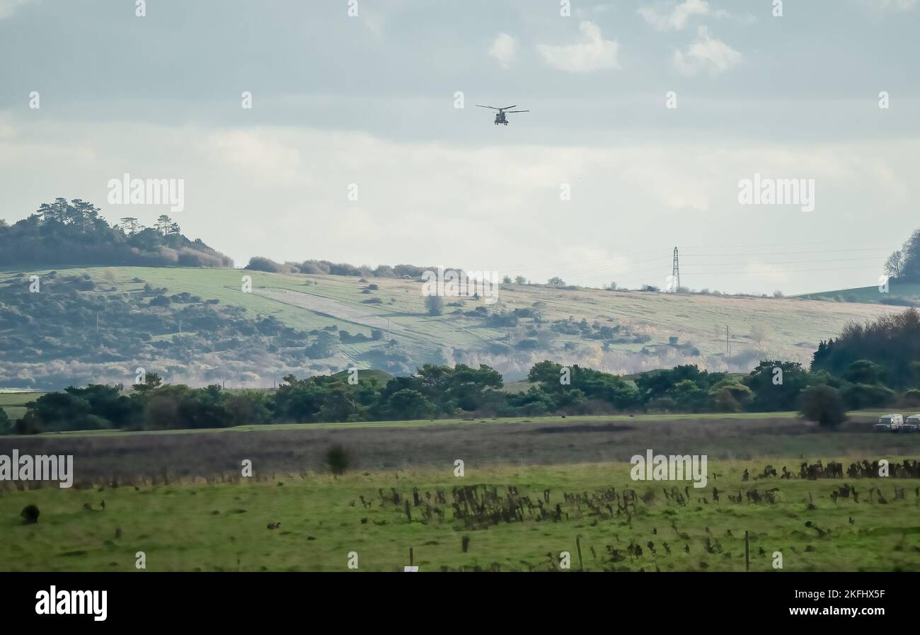 RAF Chinook tandemrotor CH47 helicopter flying fast and low in a