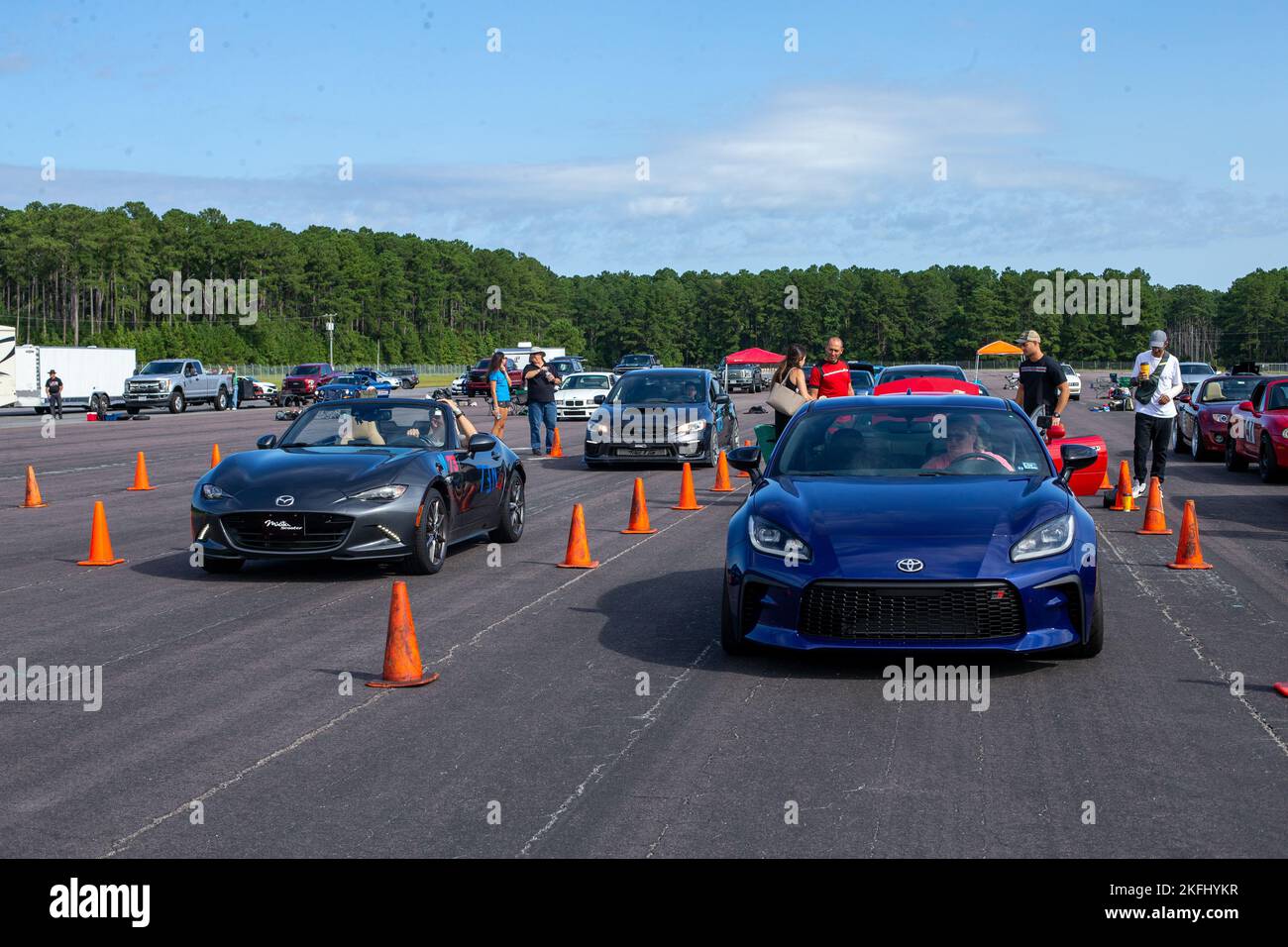Participants stage their cars on the Autocross course at Marine Corps Air Station Cherry Point, North Carolina, Sep. 17, 2022. The event was facilitated by the Sports Car Club of America and the Single Marine Program. Participants were separated by vehicle class, such as novice, street, race, American muscle, and raced for the fastest time. Stock Photo