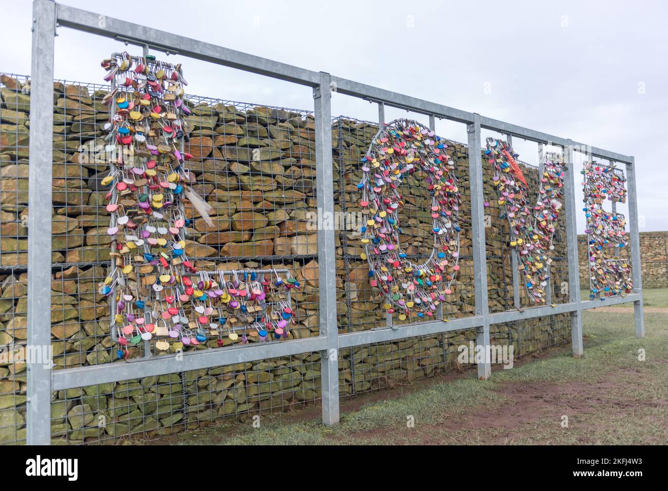 Metal frame with padlocks fastened to the steel frame. The frame is in