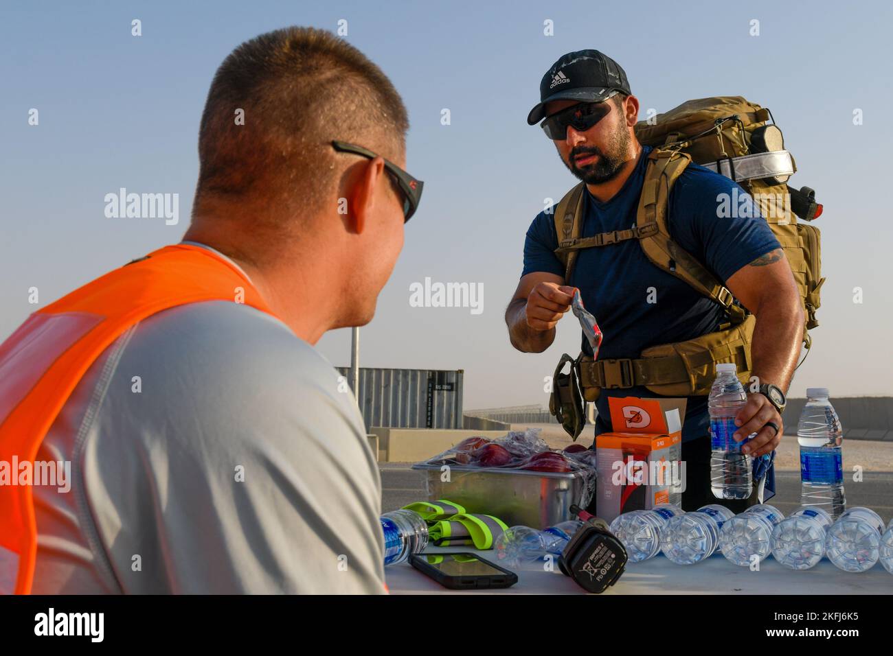 A U.S. service member deployed to Prince Sultan Air Base, Kingdom of Saudi Arabia, stops for water during a half marathon in celebration of the U.S. Air Force’s 75th Anniversary, Sept.18, 2022. The USAF official separated from the U.S. Army with the signing of the National Security Act of 1947 by former U.S. President Harry Truman. Fly, Fight and Win - Airpower Anytime, Anywhere! Stock Photo