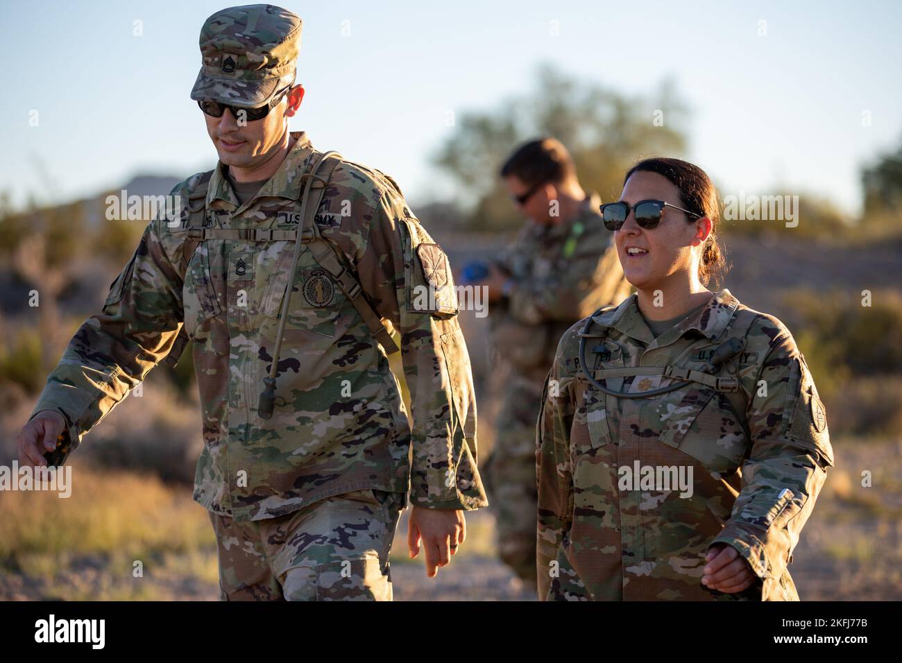 Arizona Army National Guardsman Sgt. 1st Class Benjamin Taylor, a recruiting and retention noncommissioned officer and U.S. Army Reserve Maj. Sarah Painter with Headquarters and Headquarters Company, 492nd Civil Affairs Battalion, take part in the Marche Internationale de Diekirch (MID) event in Buckeye, Arizona on September 18, 2022. The 492nd CAB conducted the MID event in order to build camaraderie and foster unit cohesion, and incentivizing completion with the MID award. Stock Photo