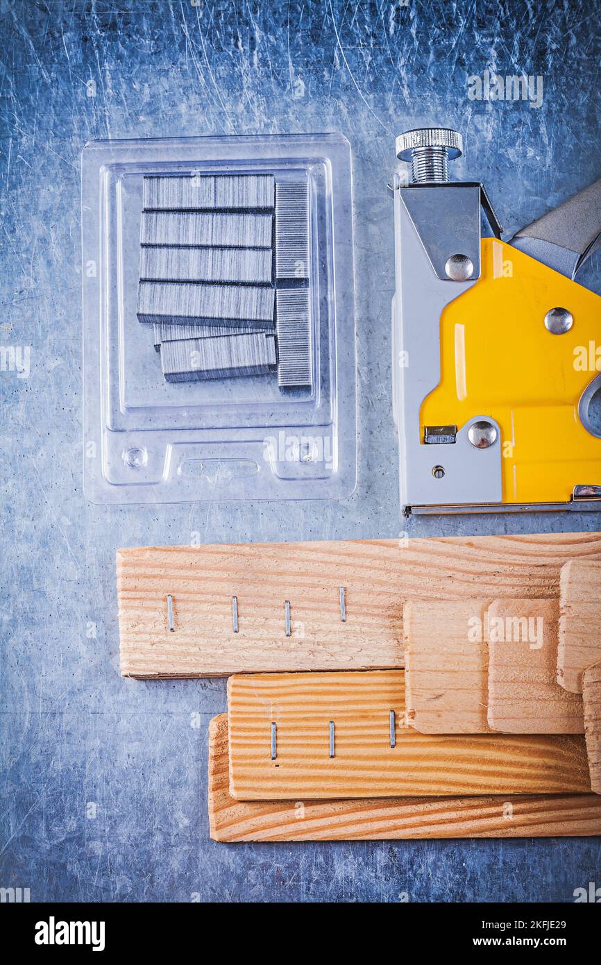 Composition of construction stapler chrome staples wooden building
