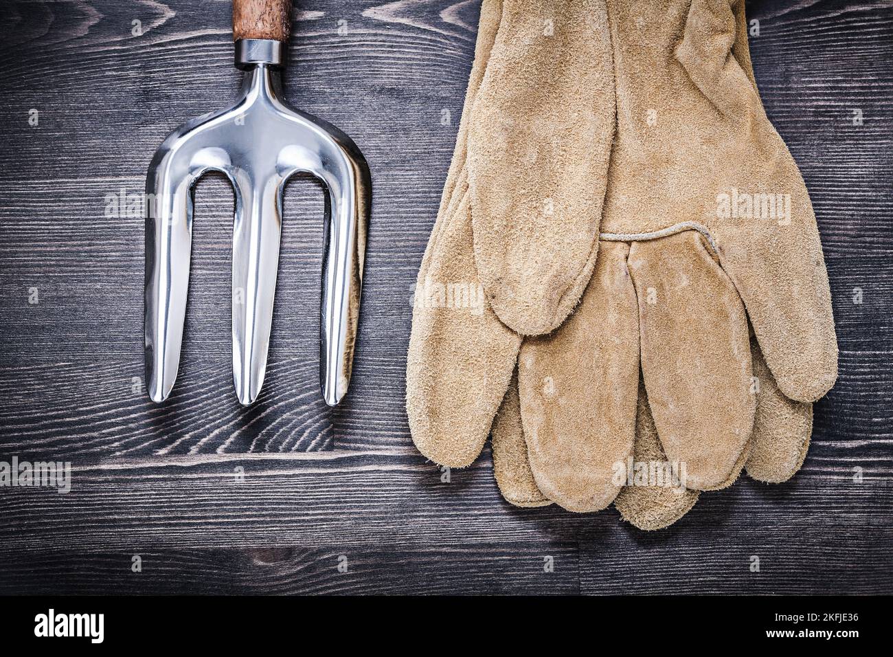 Composition of trowel fork leather safety gloves agriculture concept