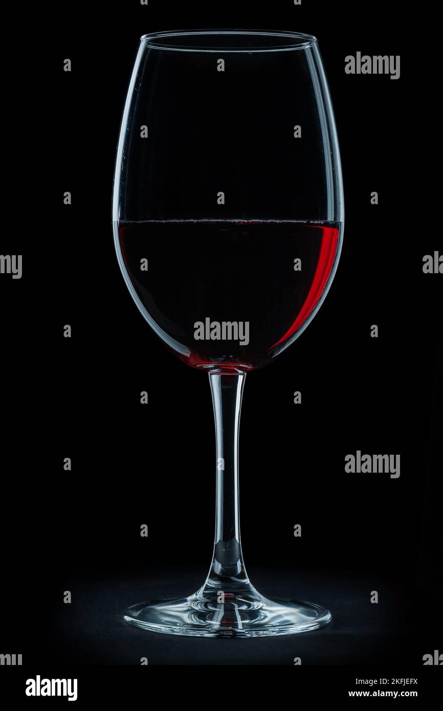 glass with red wine isolated on black background Stock Photo