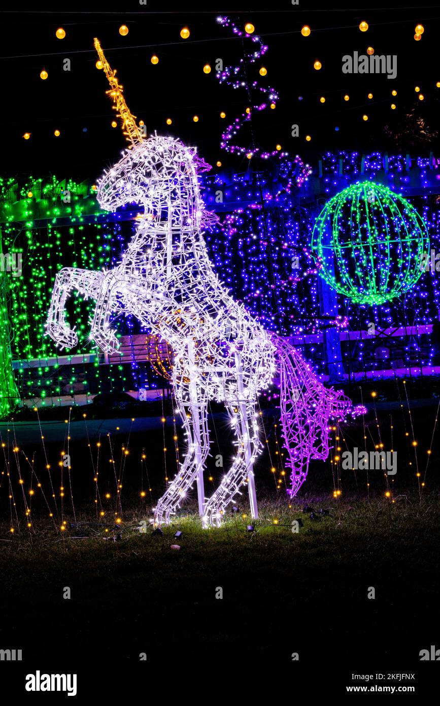 Illuminated unicorn in Rainbow Land - Winter Lights event at the North Carolina Arboretum - Asheville, North Carolina, USA Stock Photo