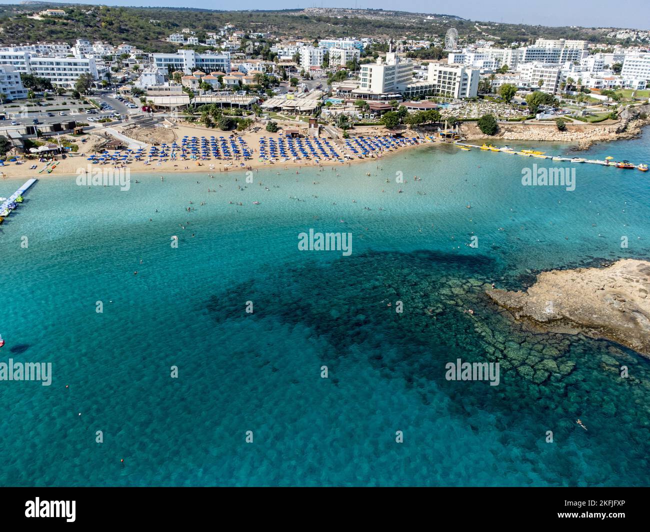 Aerial panoramic view on villas and holidays resorts and blue crystal ...
