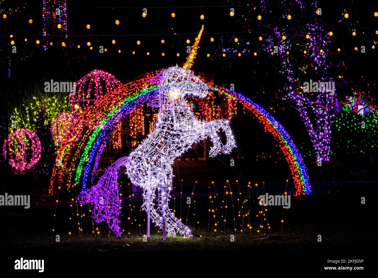 Illuminated unicorn in Rainbow Land - Winter Lights event at the North Carolina Arboretum - Asheville, North Carolina, USA Stock Photo