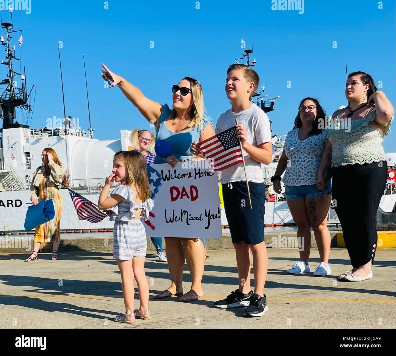 family-and-friends-of-the-uscgc-bear-wmec-901-stand-on-the-pier-in