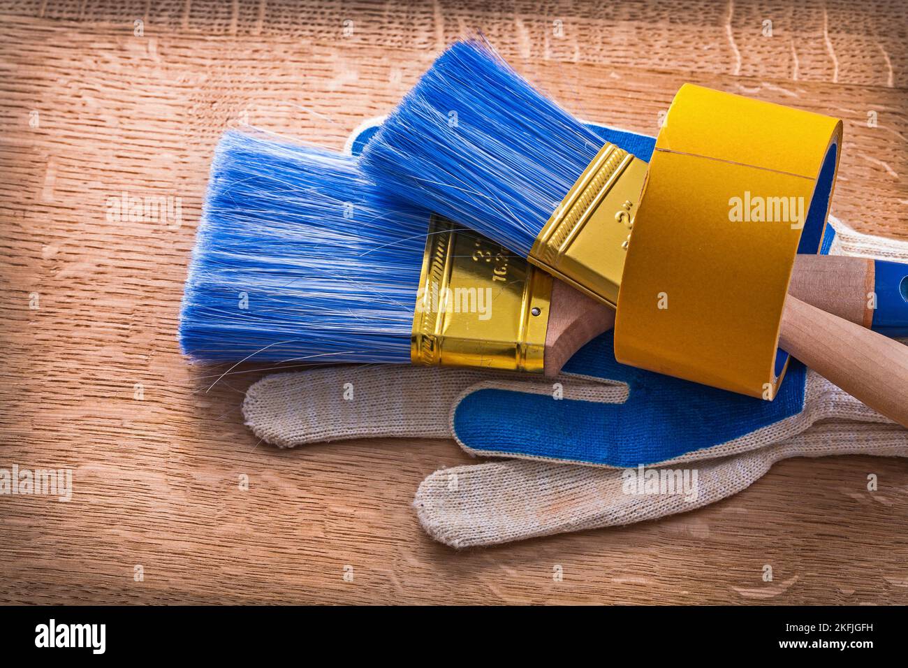Set of protective gloves with paint brushes in duct tape maintenance