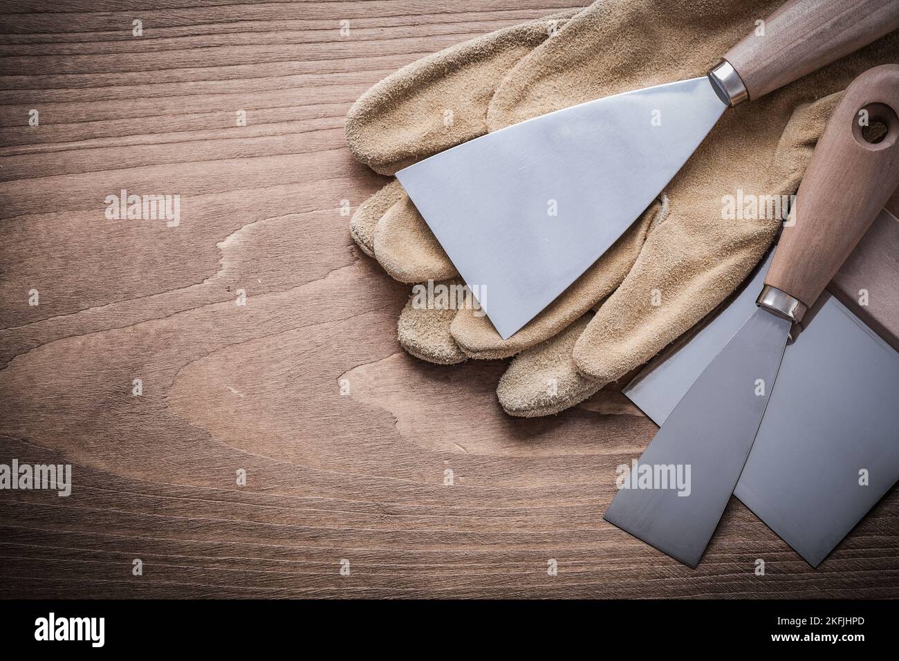 working glove putty knife paint scraper Stock Photo Alamy