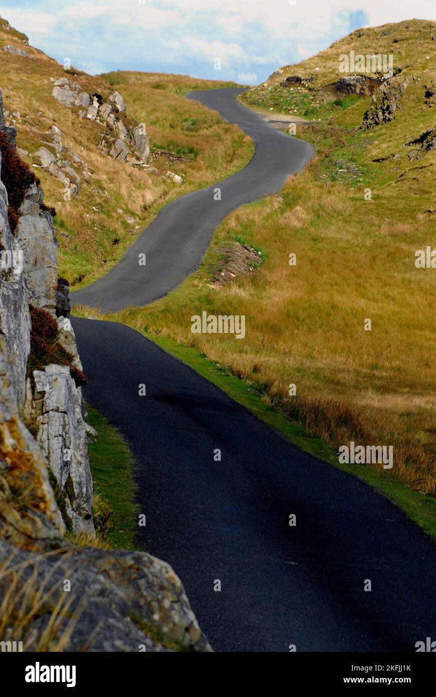 A vertical shot of the long road up to the famous cliffs of Slieve League in county Donegal, Ireland.  The highest accessible sea cliff in Europe. Stock Photo