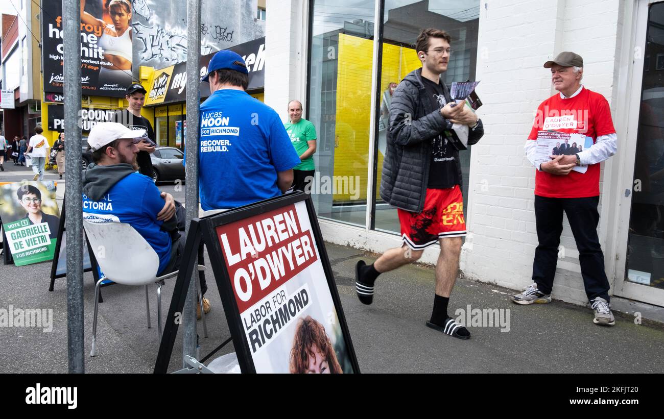 Volunters handout political information at an early voting centre for the Victorian State elections. Fitzroy, Melbourne, Victoria, Australia. Stock Photo