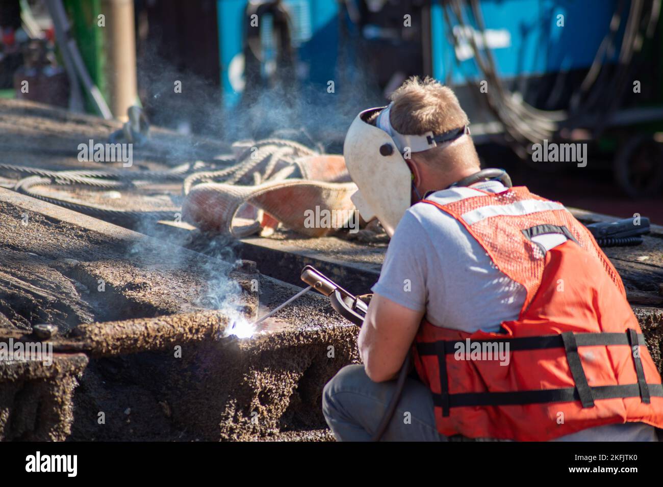 Lock and Dam repairers continue to work on the wickets while they are pulled from the Illinois Waterway before being reinstalled. Stock Photo